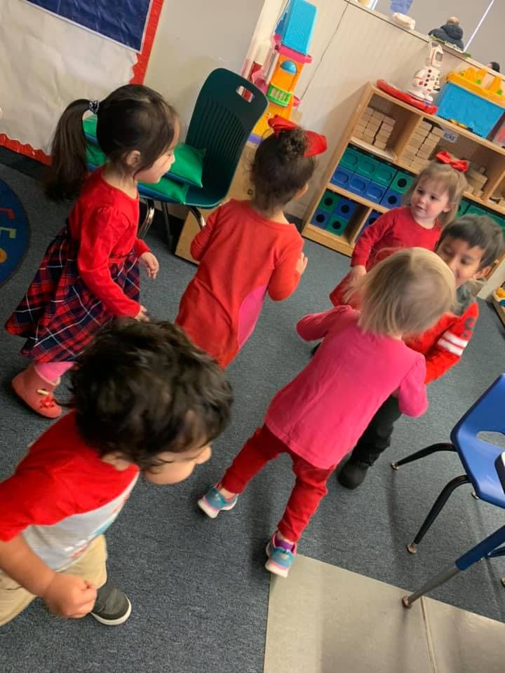 Group of children playing in a classroom