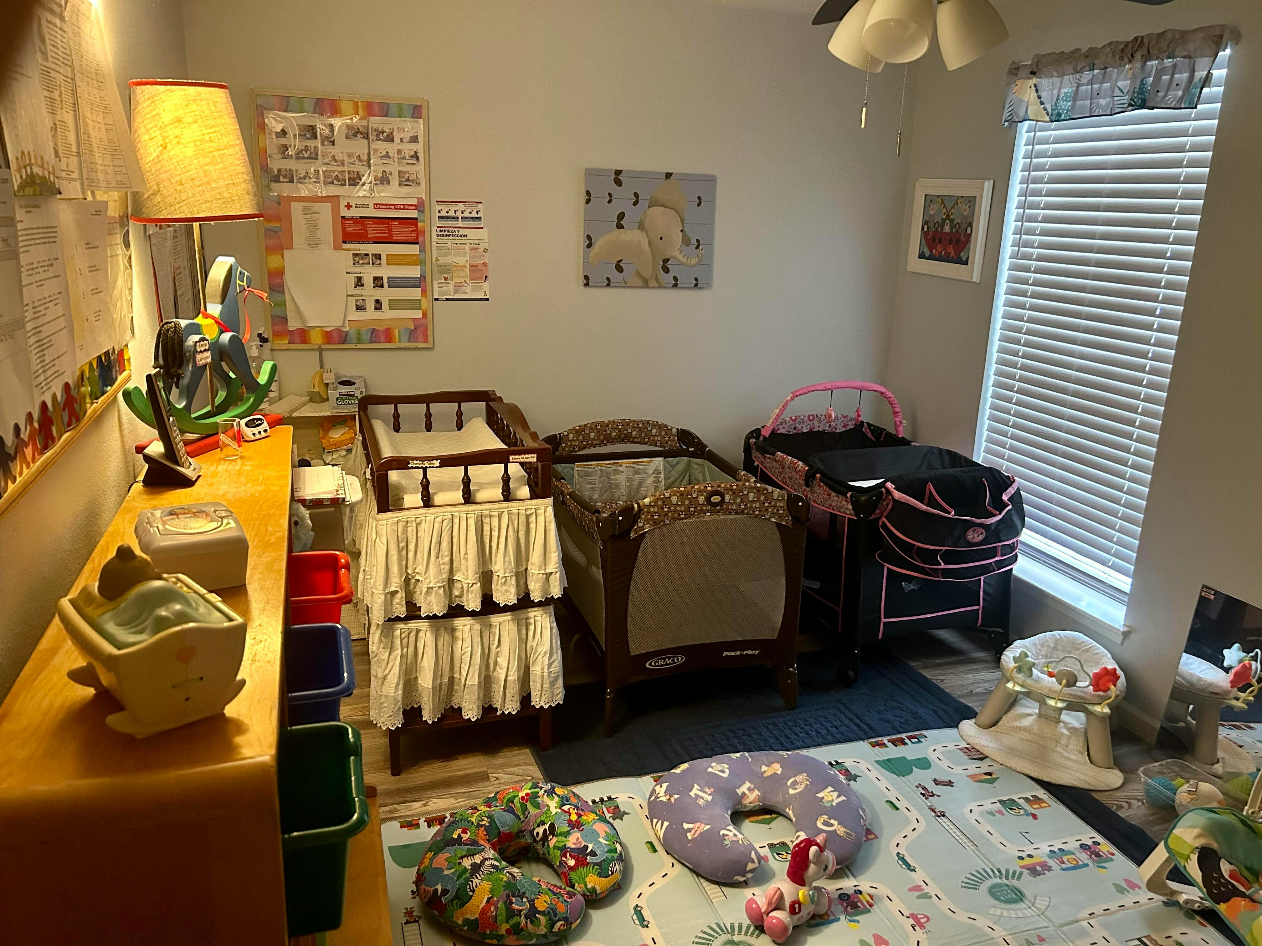 Room with multiple cribs and changing tables