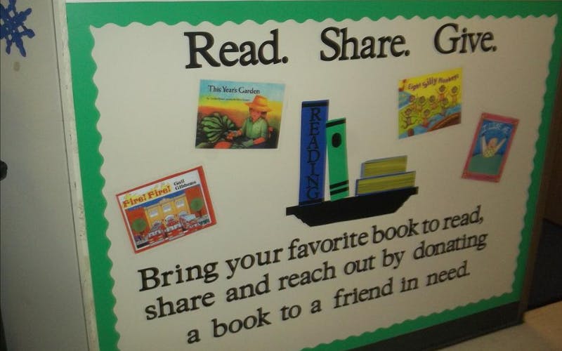 Bulletin board with text "Read. Share. Give." and "Bring your favorite book"
