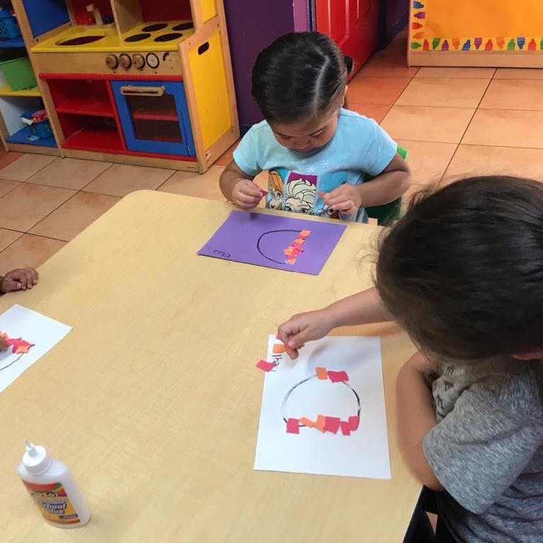 Children doing crafts at a table
