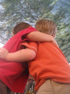 Two children hugging