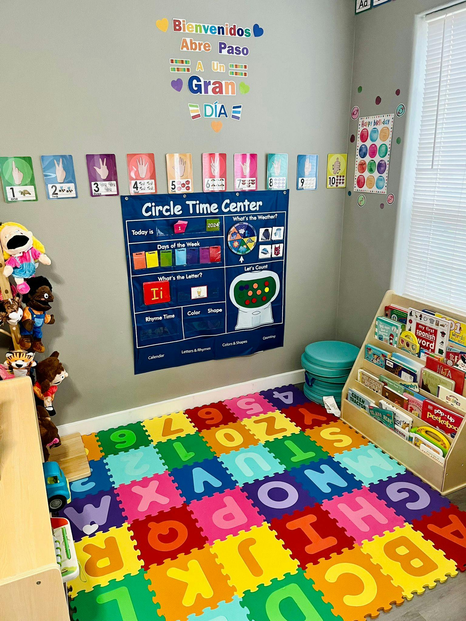 Classroom corner with a colorful alphabet and number floor mat