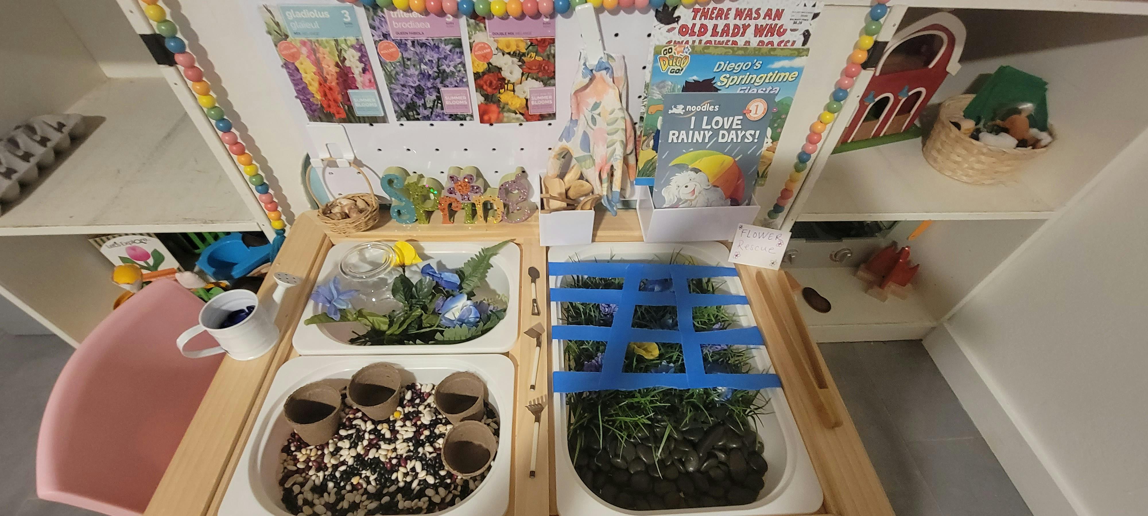 Sensory table with various natural elements and craft supplies