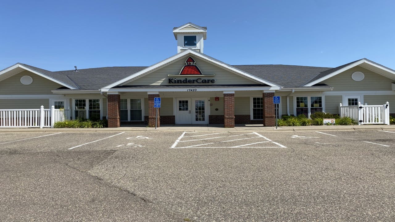 KinderCare building with a parking lot in the foreground