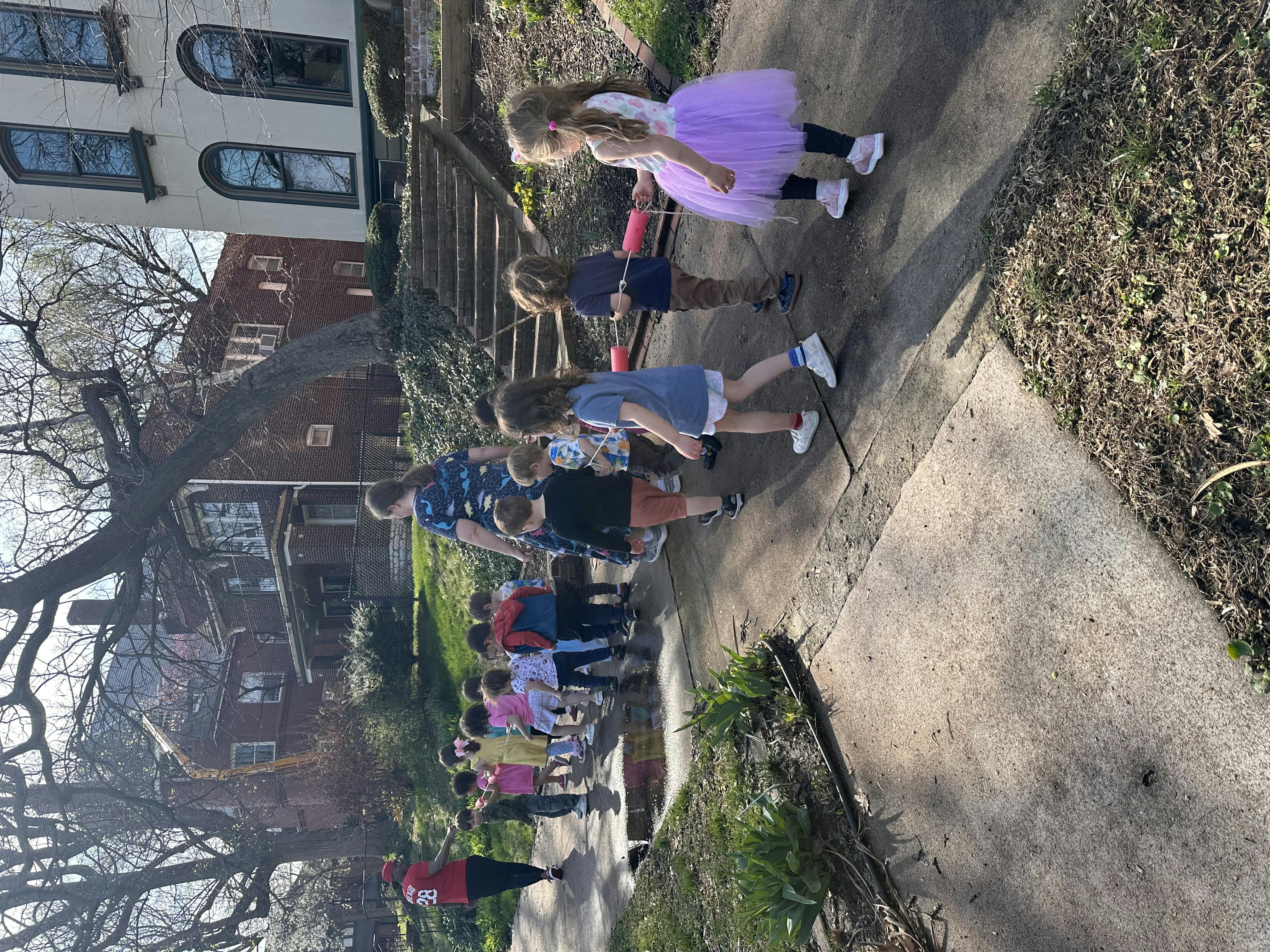 Children walking on a sidewalk