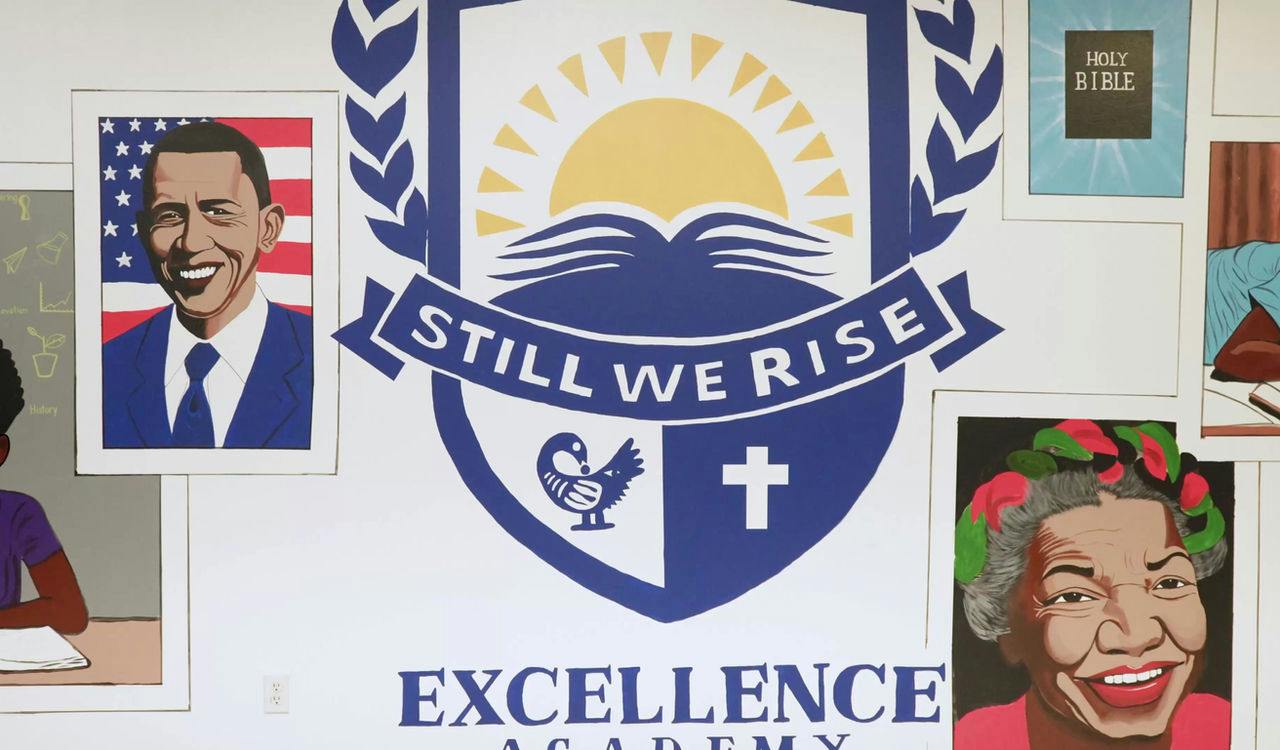 Mural at Excellence Academy with crest and portraits