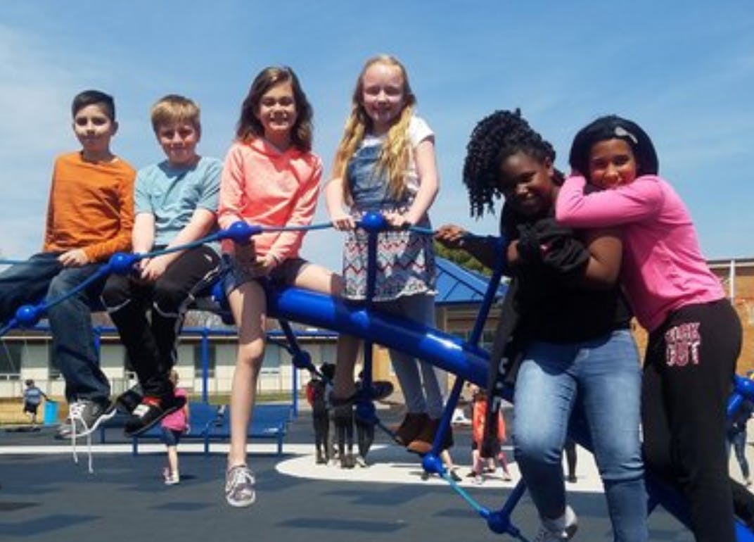 Group of children on playground equipment