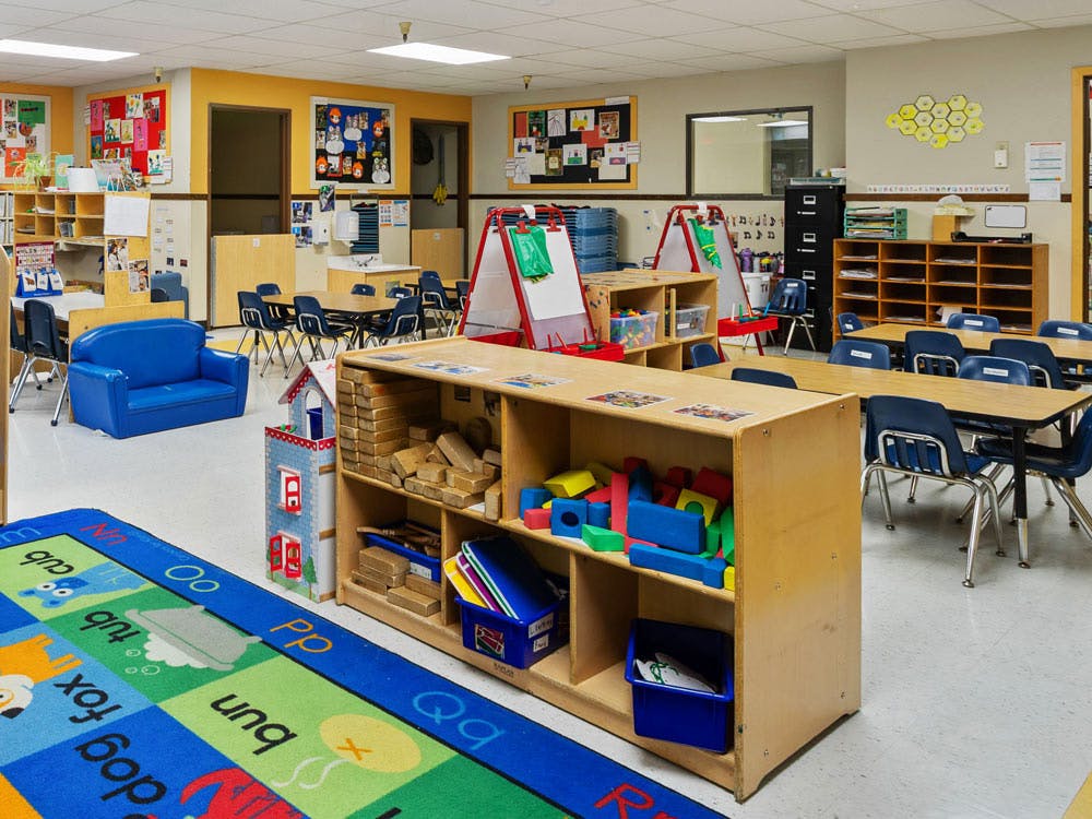 Colorful classroom with child-sized furniture and learning materials