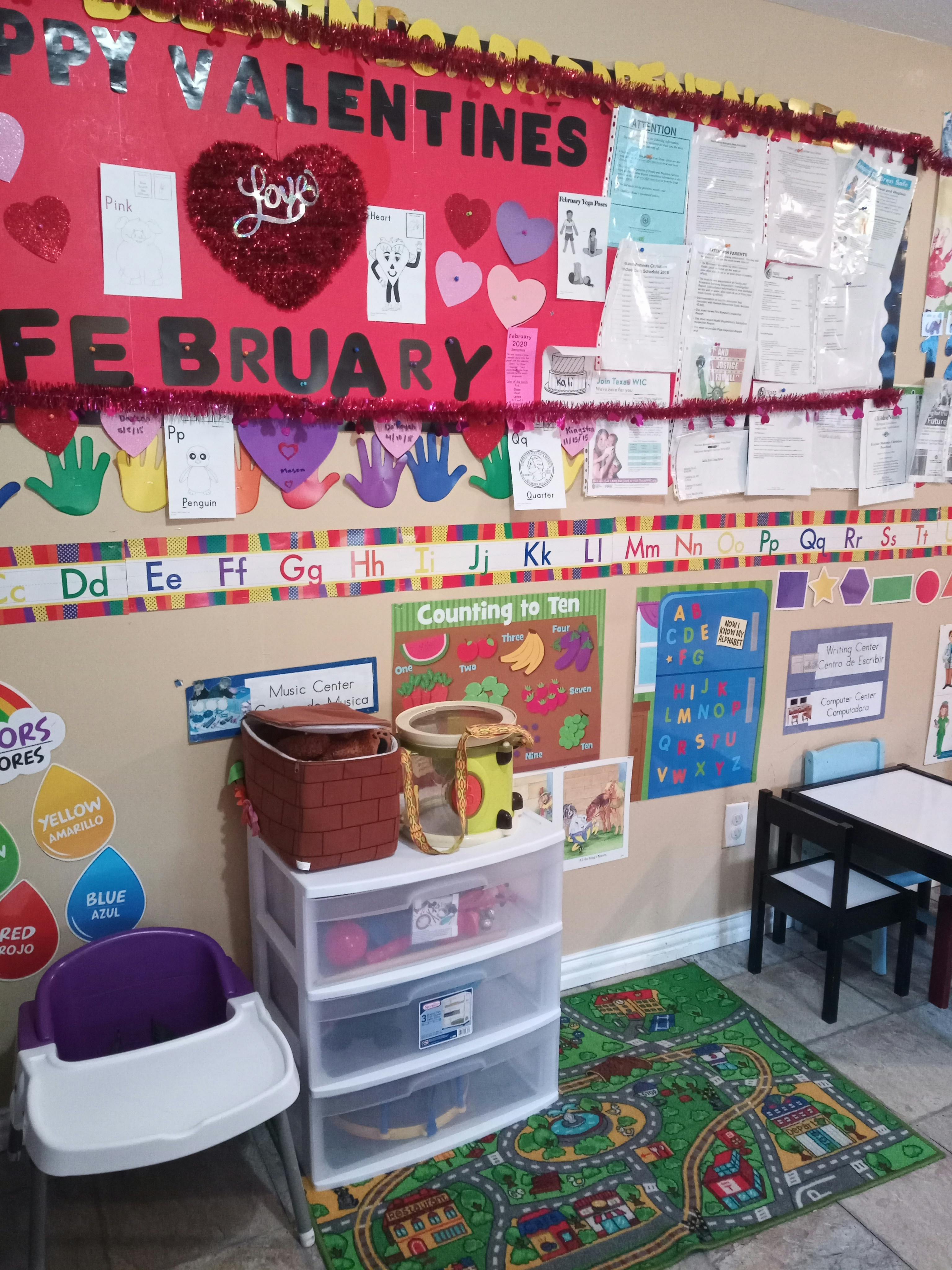 Classroom wall with a "Happy Valentines February" display and alphabet
