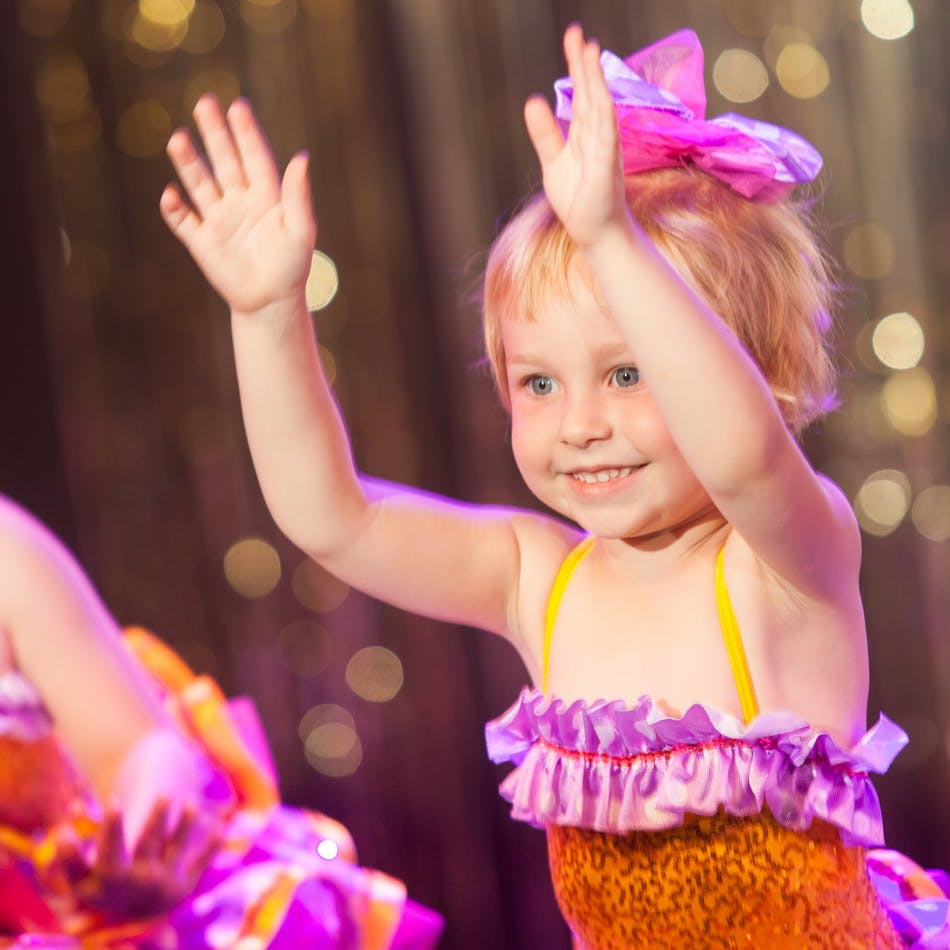 Child with hands raised