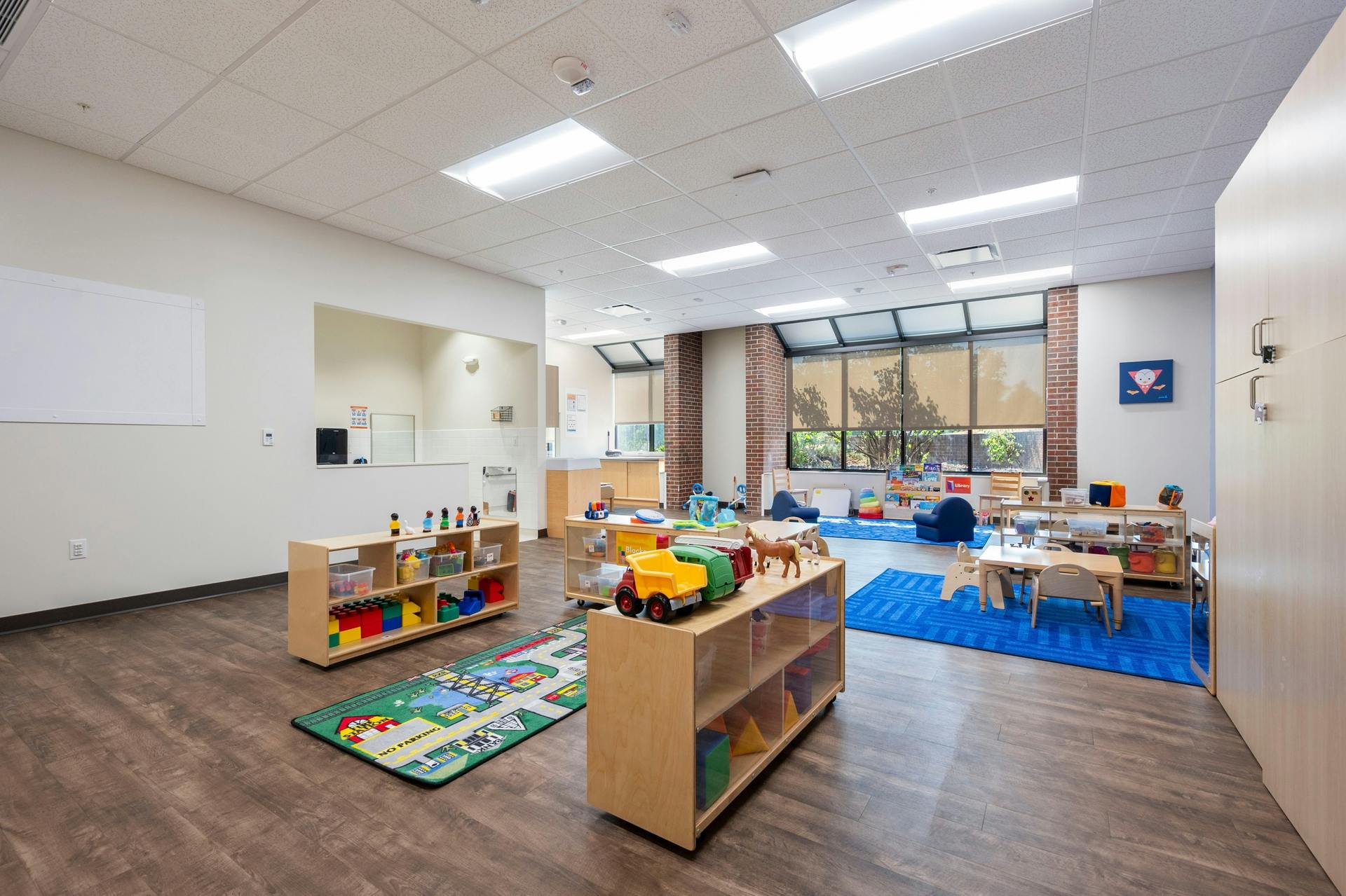 Colorful and organized play area with toys and small furniture