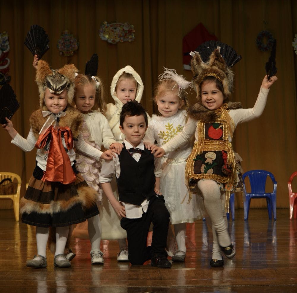 Group of children in costumes on a stage