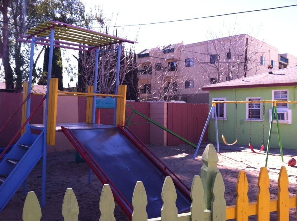 Playground with slide, monkey bars, and swings