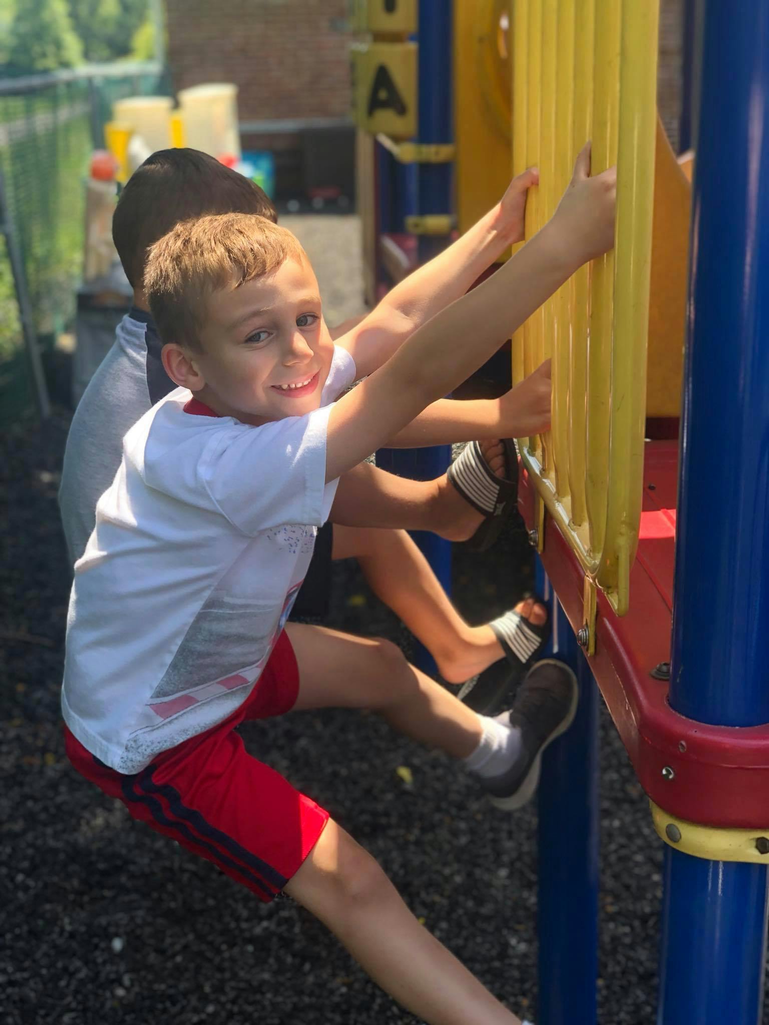 Child climbing on playground equipment