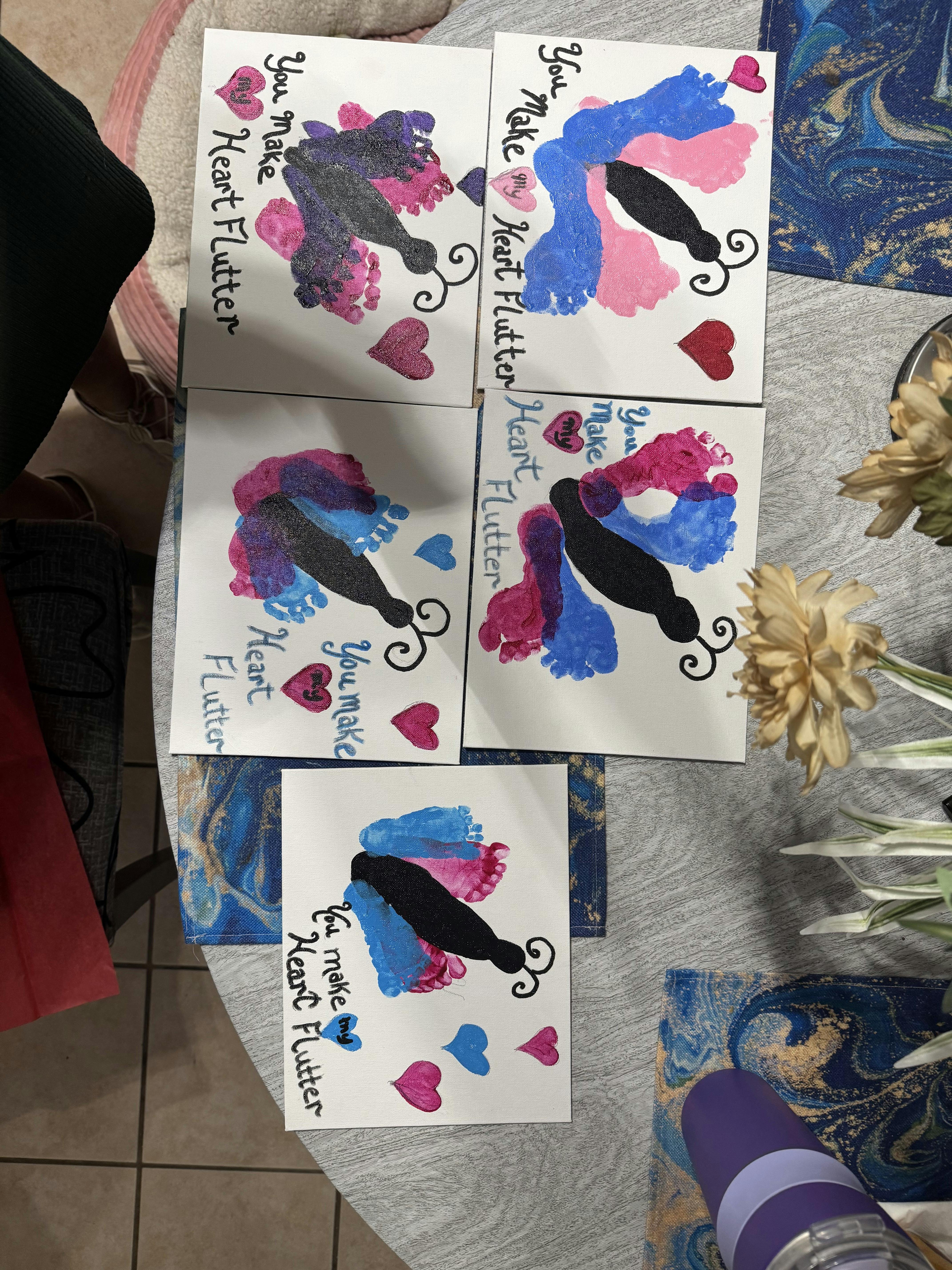 Five handmade butterfly crafts with footprint wings and You make my heart flutter