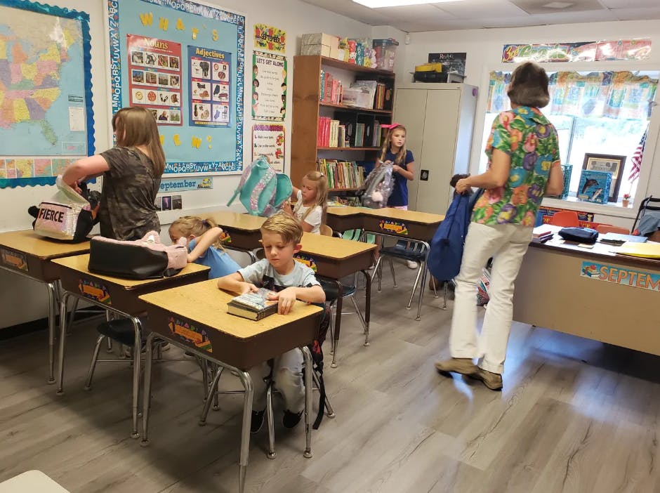 Adult and children in a classroom