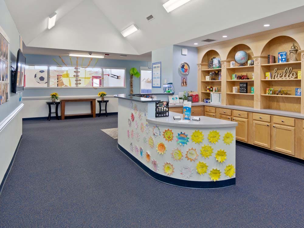 Reception desk in a childcare or school setting with children's artwork
