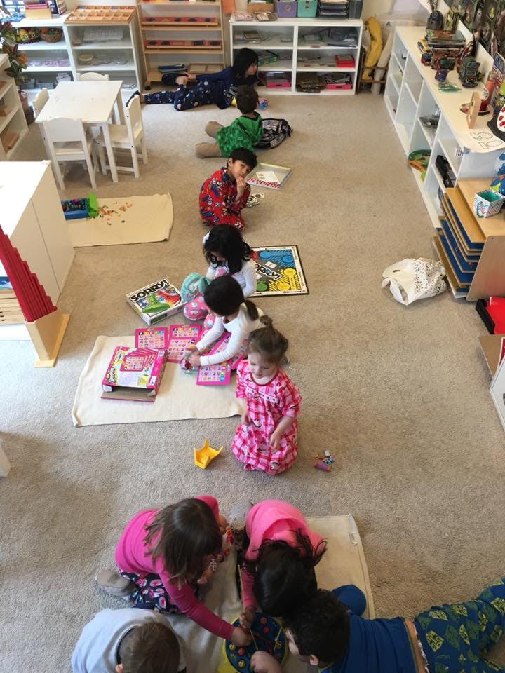 Children playing on the floor in a classroom