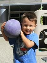 Child holding a ball