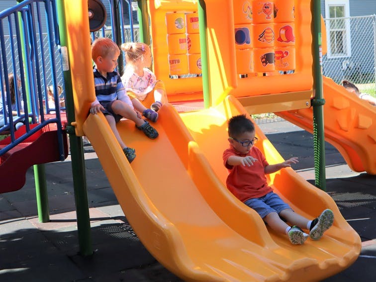 Children on a playground slide