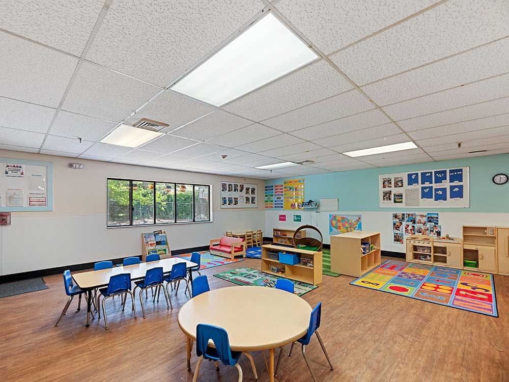 Children's classroom with small tables and chairs