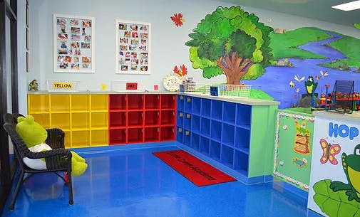 Colorful classroom with cubbies and a mural