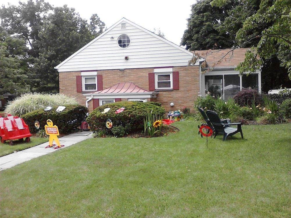 House with a front yard and decorative bushes