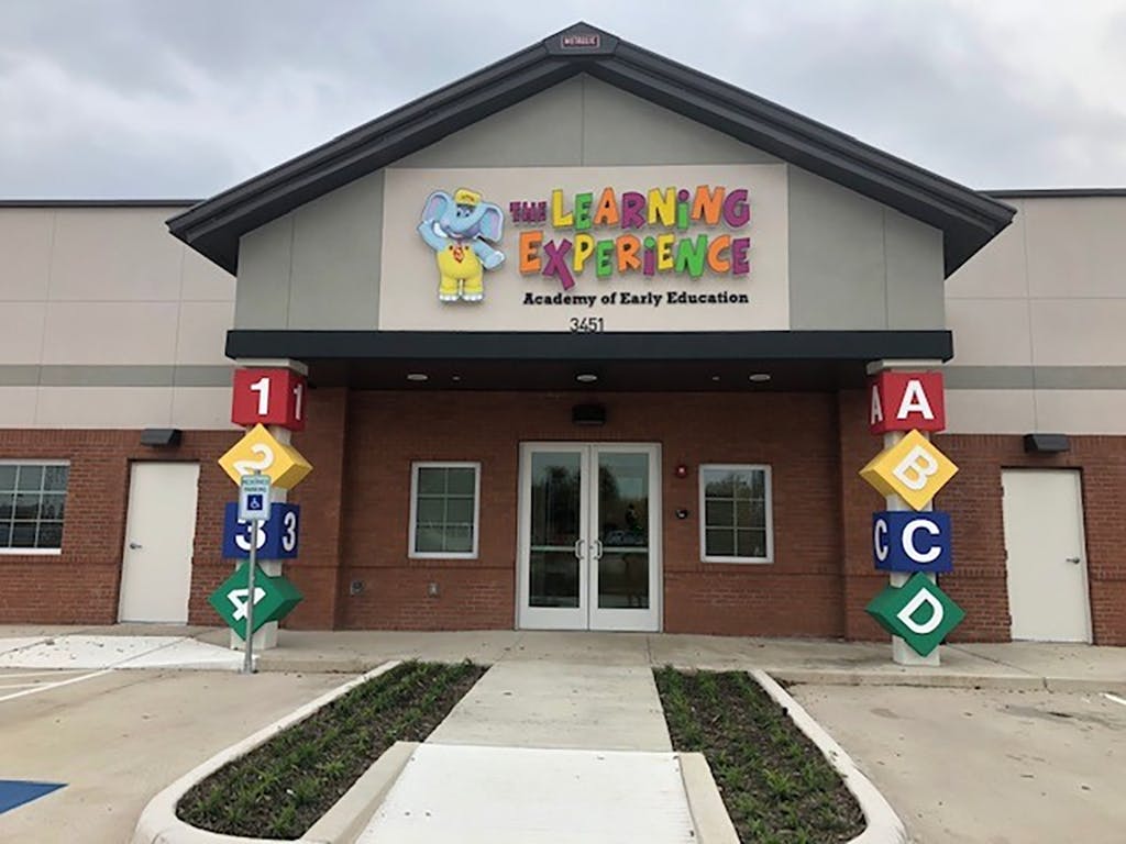 Building with "The Learning Experience" sign above the entrance