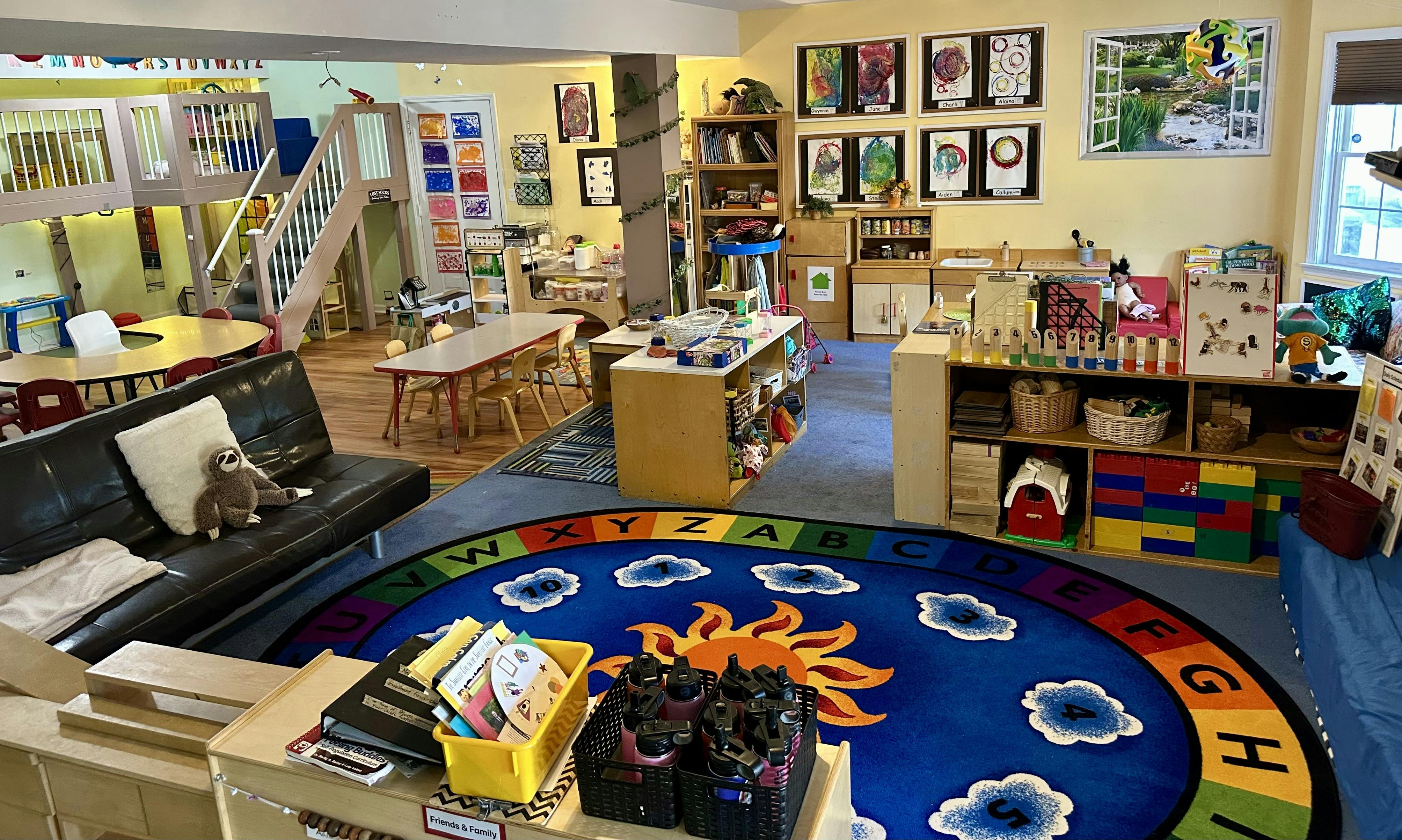 Colorful preschool classroom with furniture and learning materials