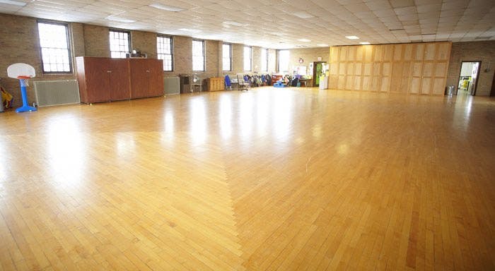 Empty room with hardwood floor and windows