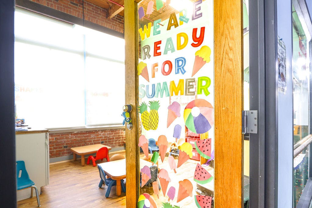 Door decorated with "We are ready for summer" and summer-themed cutouts