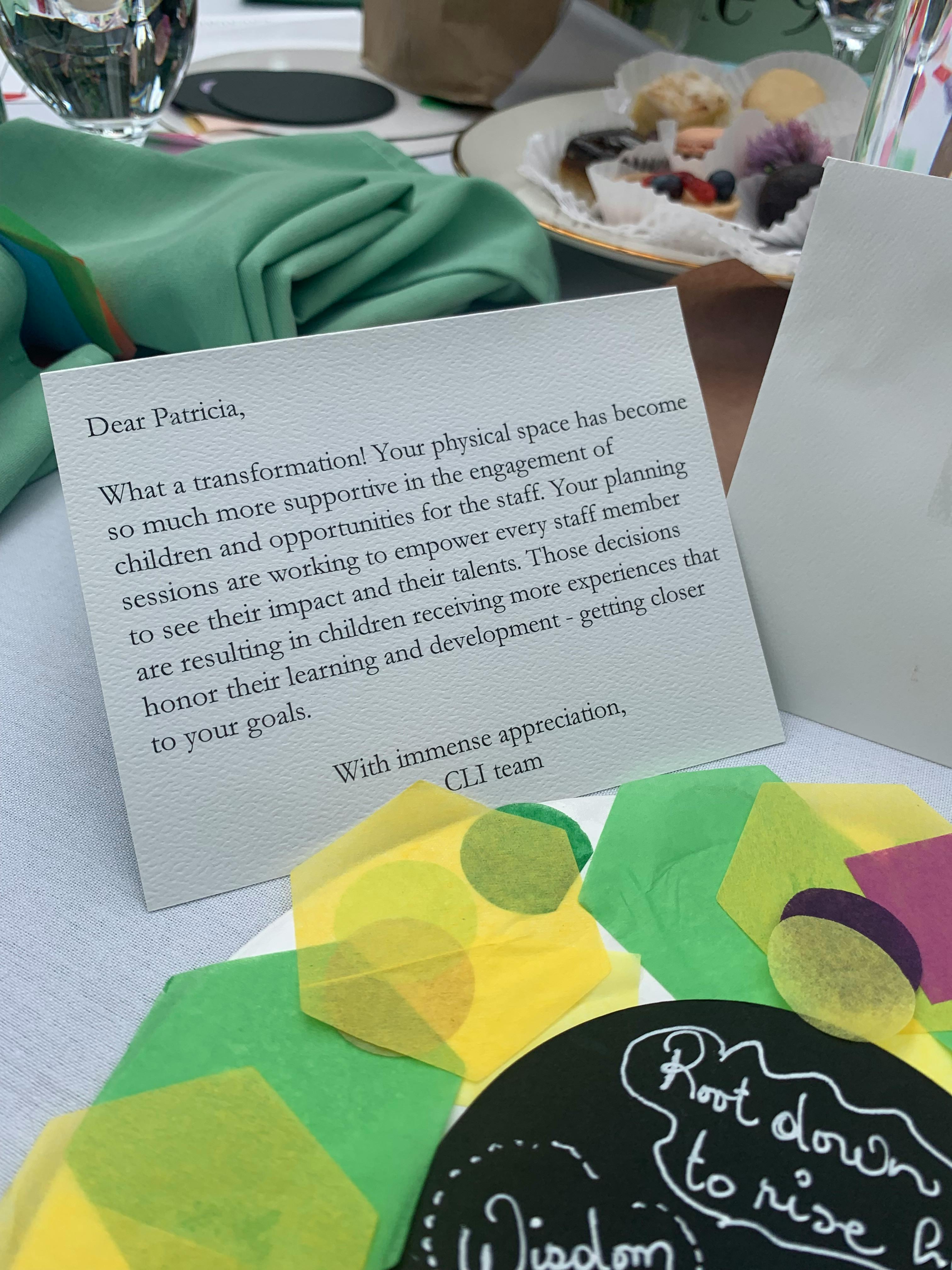 Card with text "Dear Patricia" and "Root down to rise" on a black circle