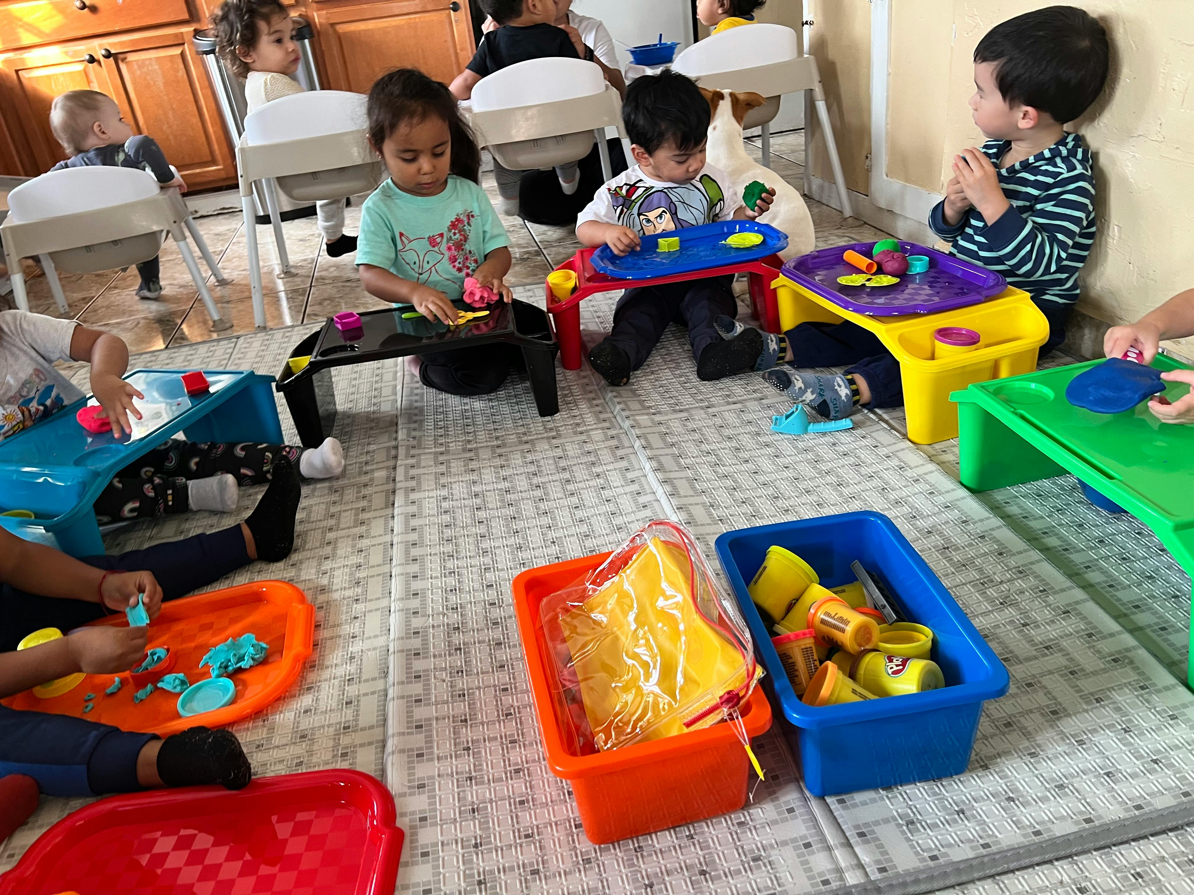 Children playing with toys on the floor