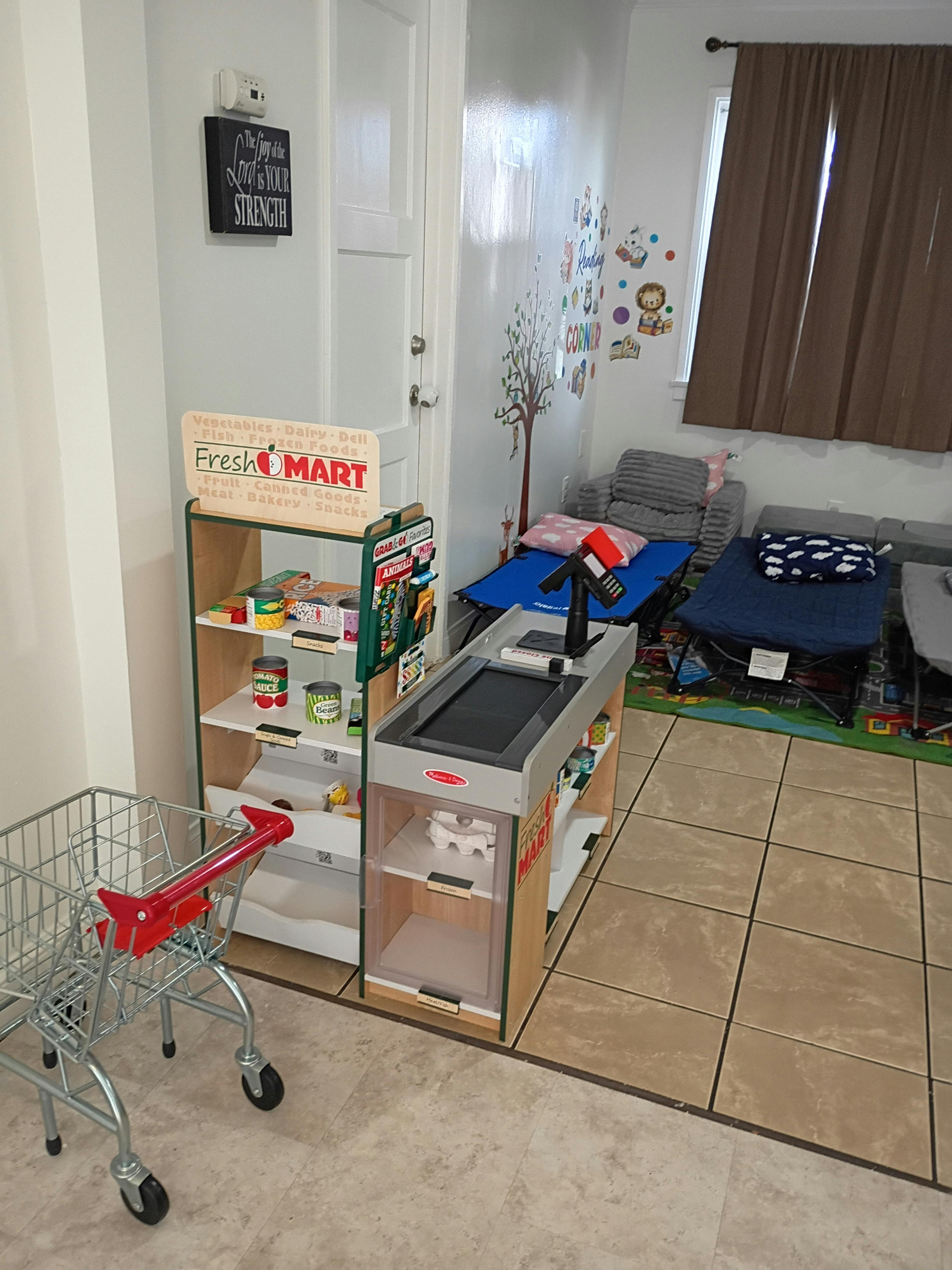 Child's toy grocery store with mini shopping cart, Fresh O Mart sign