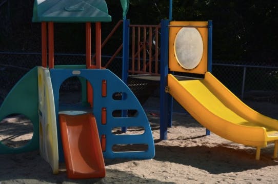 Playground structure with multiple slides