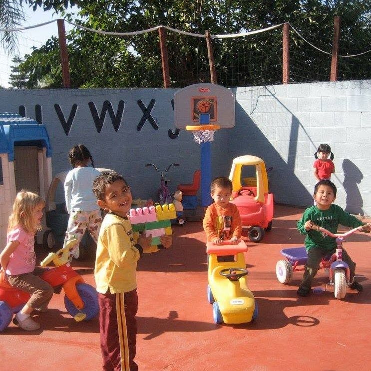 Children playing with toys on a playground