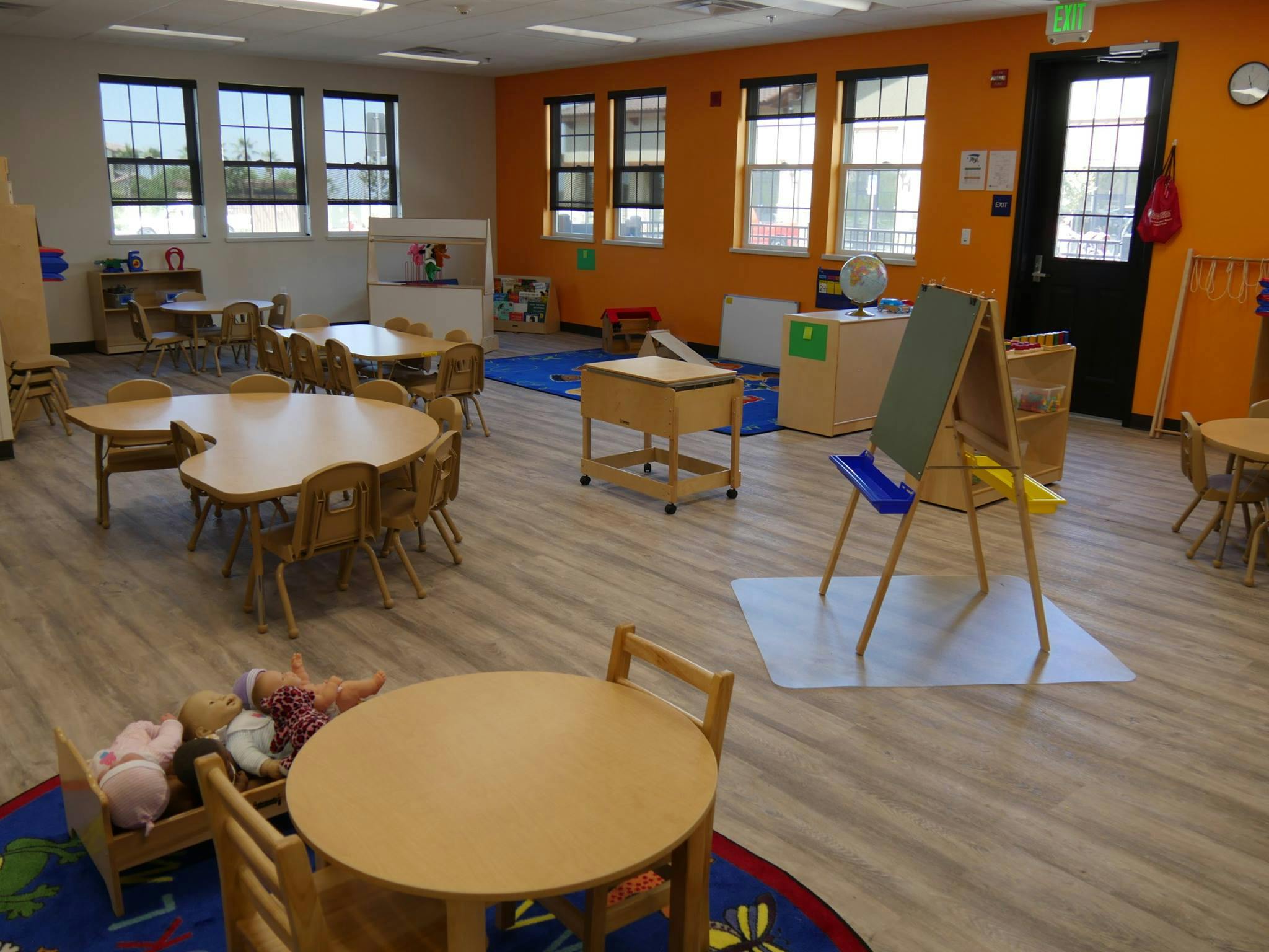 Empty classroom with small tables and chairs