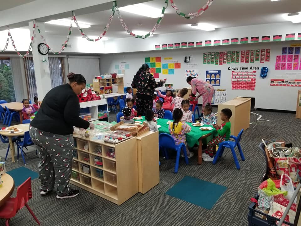 Adults and children in a classroom