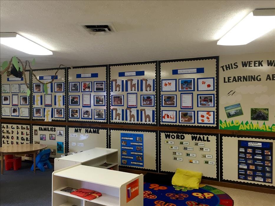Classroom with children's artwork and educational posters on the walls