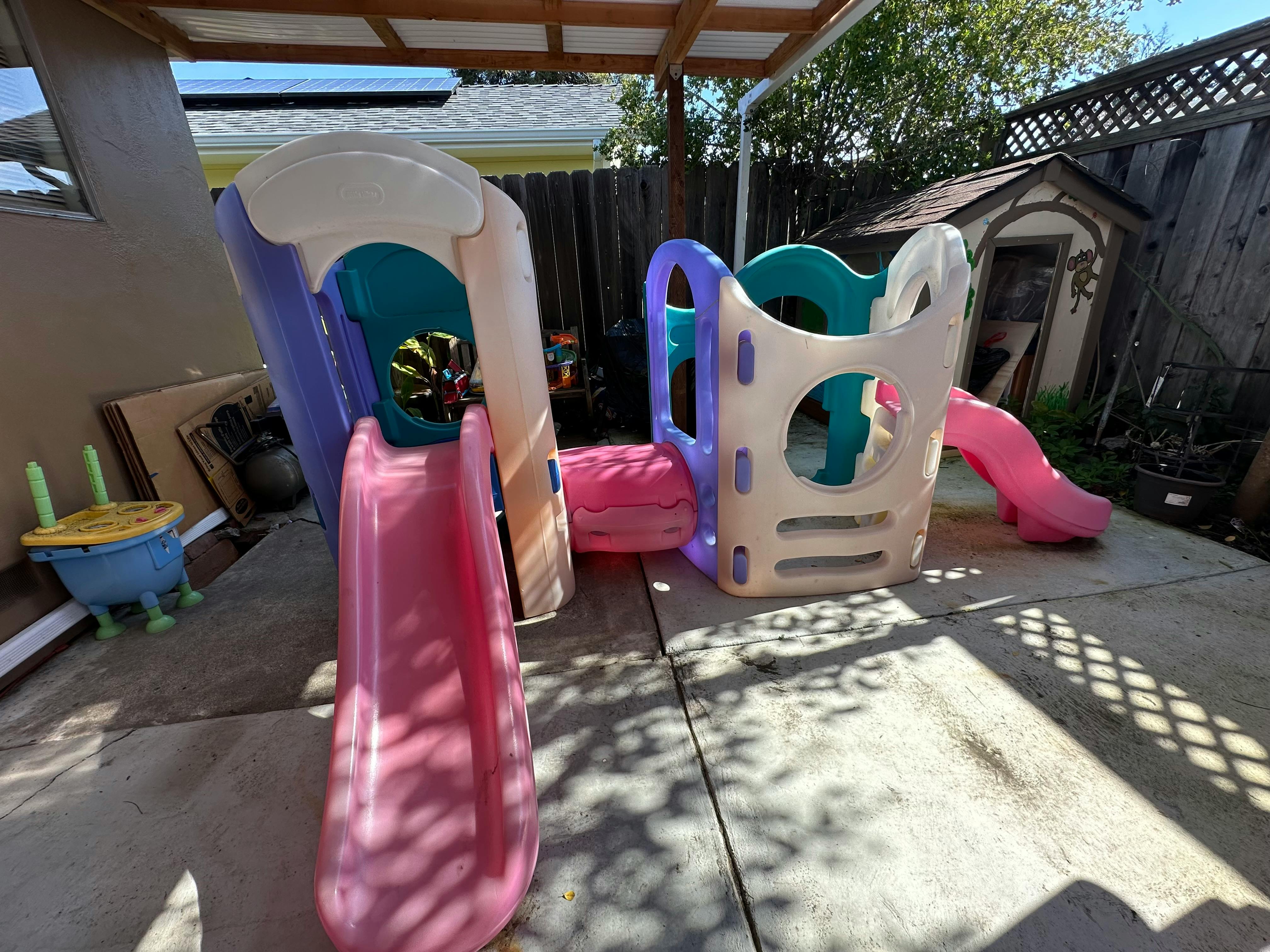 Plastic playground with slides and climbing structure