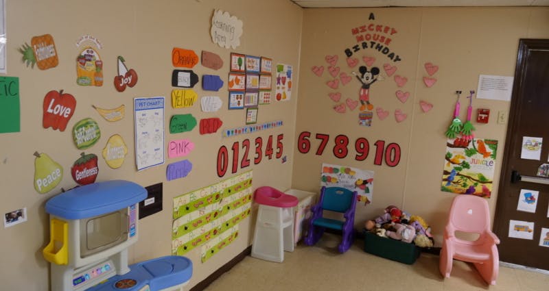 Classroom with colorful decorations, numbers, and play furniture