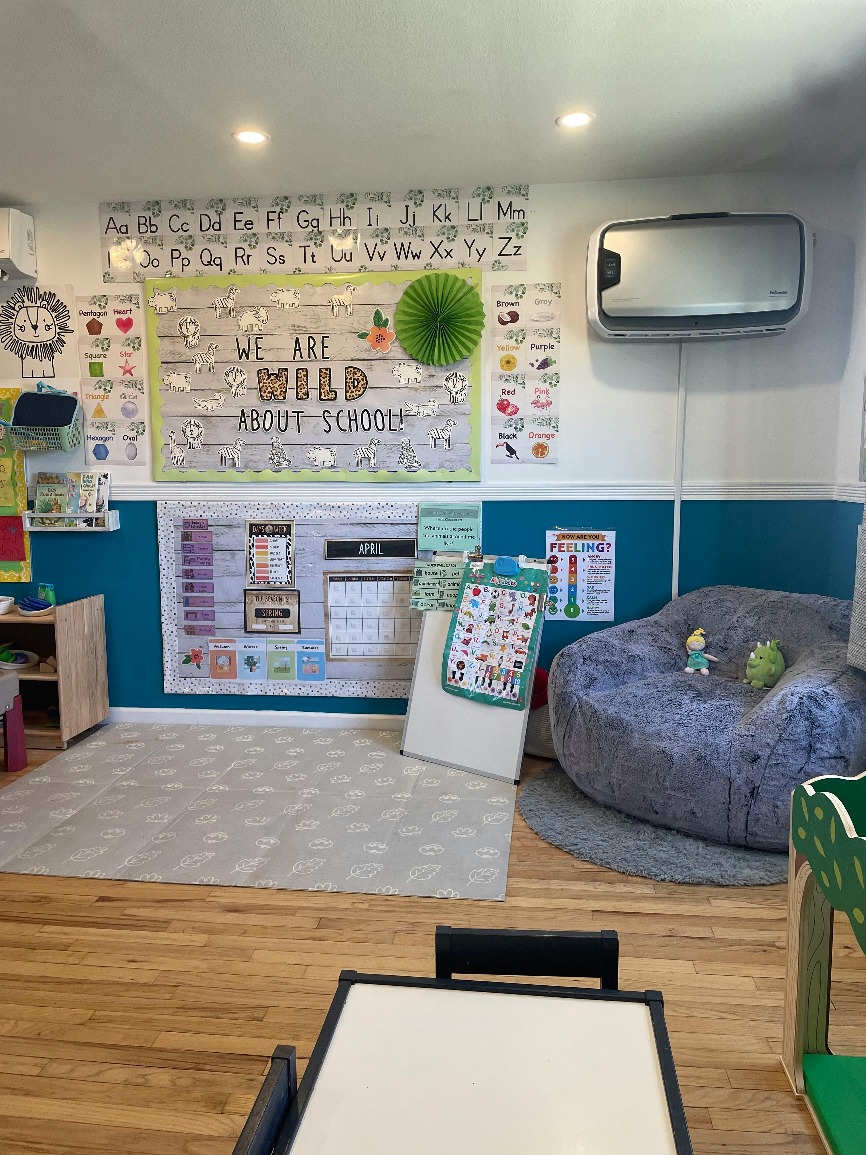 Classroom with bulletin board, beanbag chair, and small table