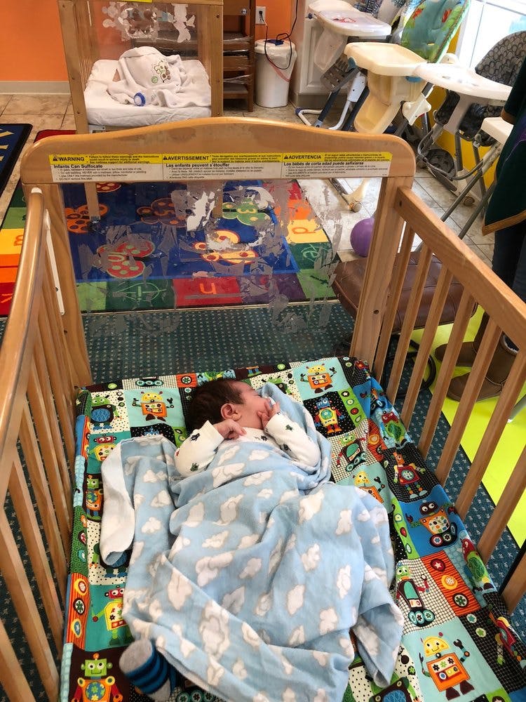 Child sleeping in a crib