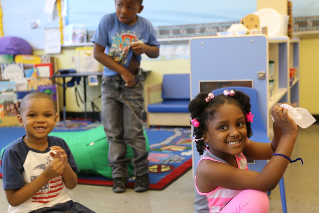 Three children in a classroom