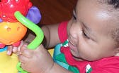 Child playing with colorful toy