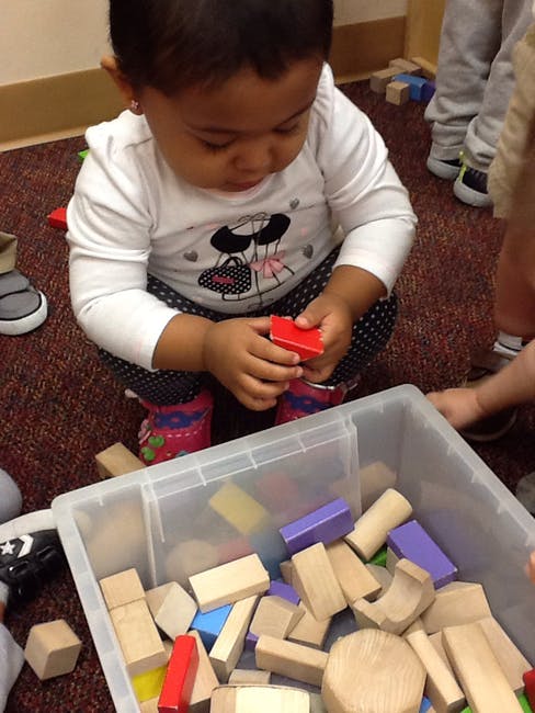 Child playing with building blocks