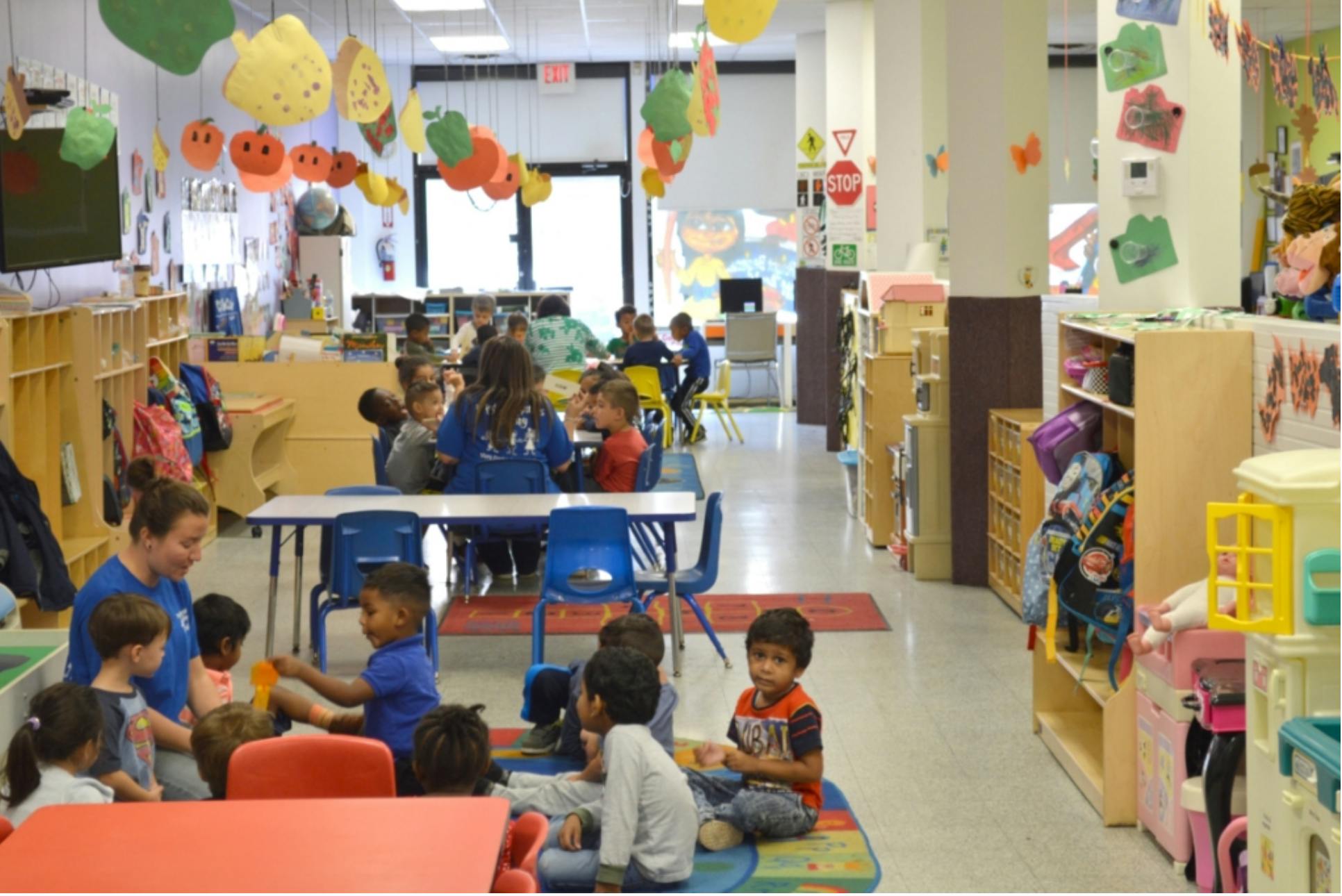 Adult and children in a classroom