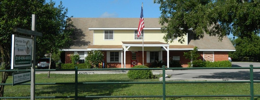 Building with an American flag flying in front