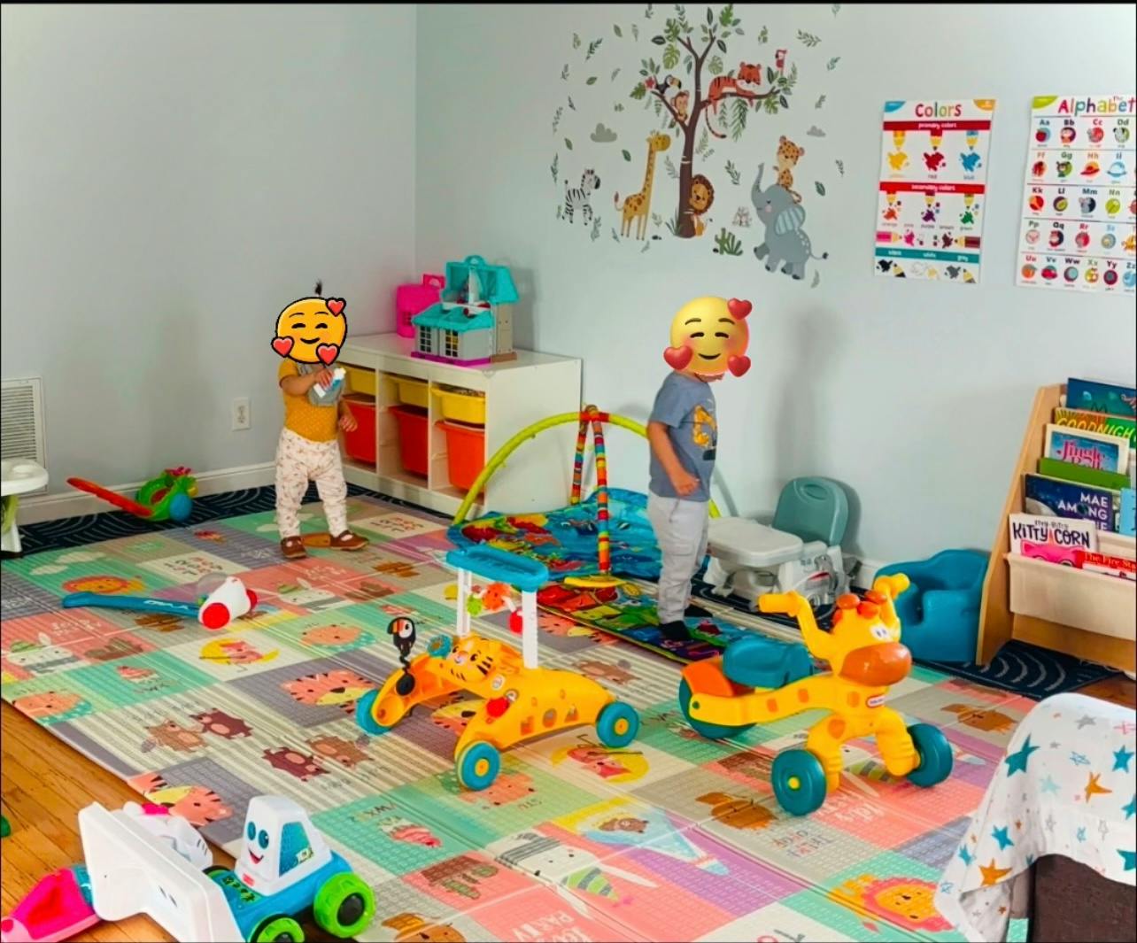 Two children playing with toys in a brightly lit room