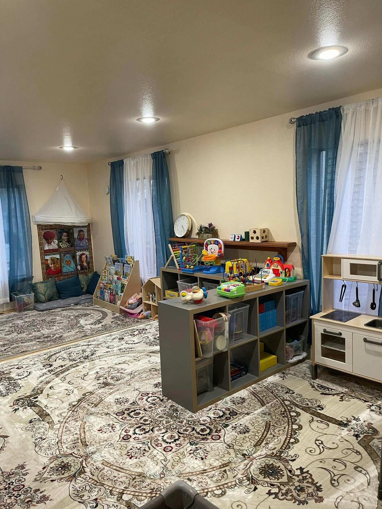 Playroom with toys, shelves, and a play kitchen